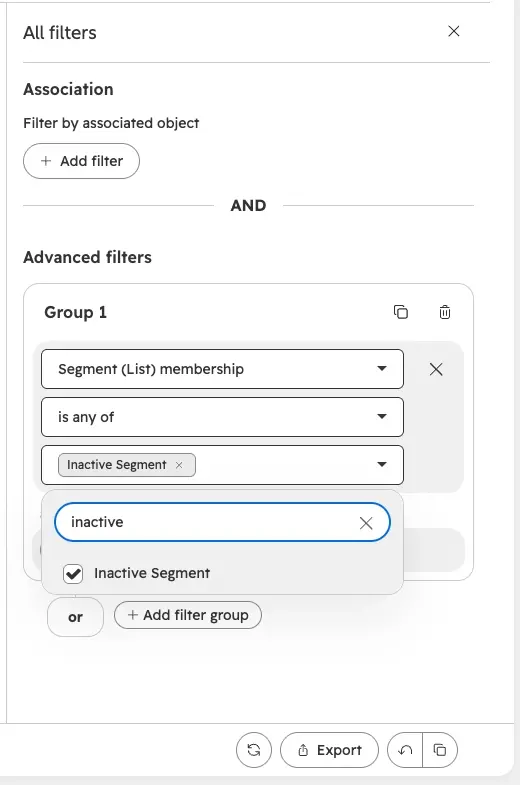 HubSpot contacts saved view with a filter that excludes members of an Inactive Contacts segment